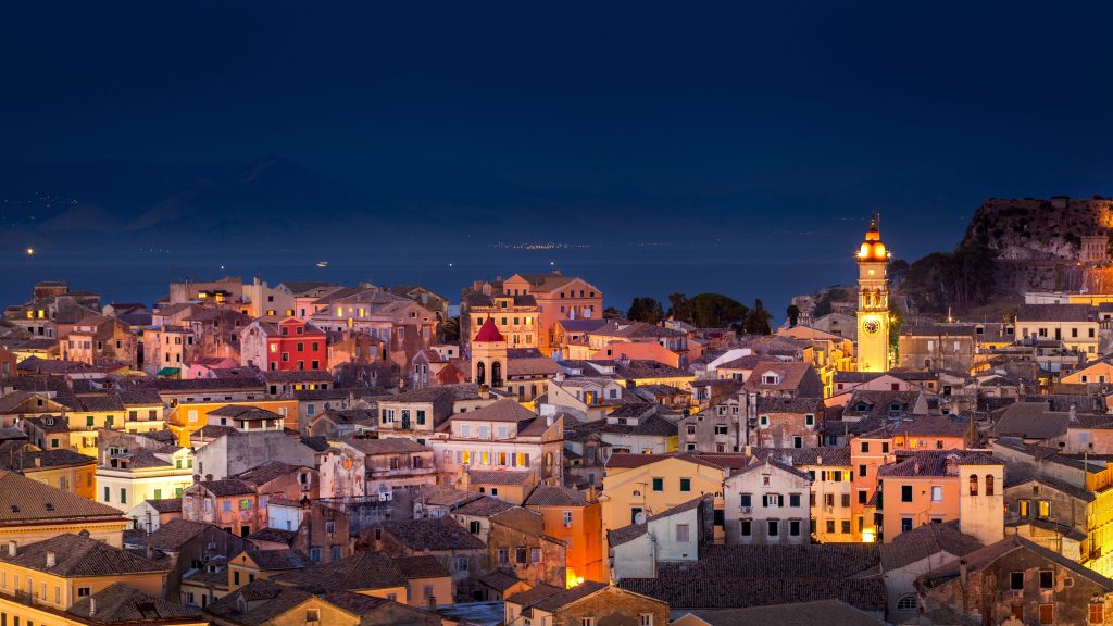 Panoramic view of the citylights of Corfu Town at night. Kerkyra. Greece, Corfu island